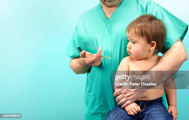 doctor giving baby boy injection - mmr bildbanksfoton och bilder