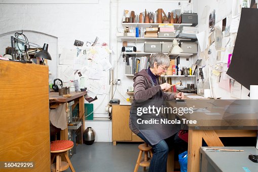 A jeweller working in workshop A jeweller working in workshop