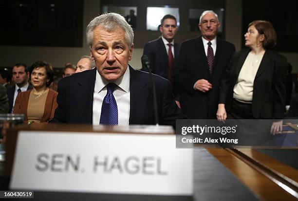 Former U.S. Sen. Chuck Hagel takes his seat as he arrives at his confirmation hearing to become the next secretary of defense before the Senate Armed...