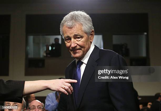 Former U.S. Sen. Chuck Hagel arrives at his confirmation hearing to become the next secretary of defense before the Senate Armed Services Committee...