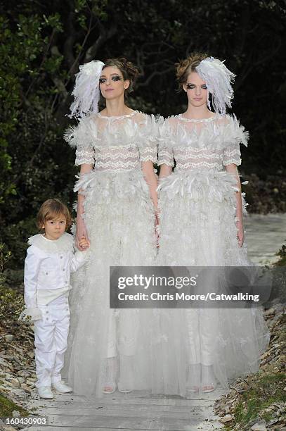 Models walk the runway at the Chanel Spring Summer 2013 fashion show during Paris Haute Couture Fashion Week on January 22, 2013 in Paris, France.