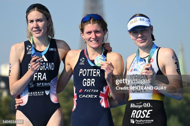 First placed England's Beth Potter , Second placed France's Cassandre Beaugrand and third placed Germany's Laura Lindemann celebrate on the podium at...
