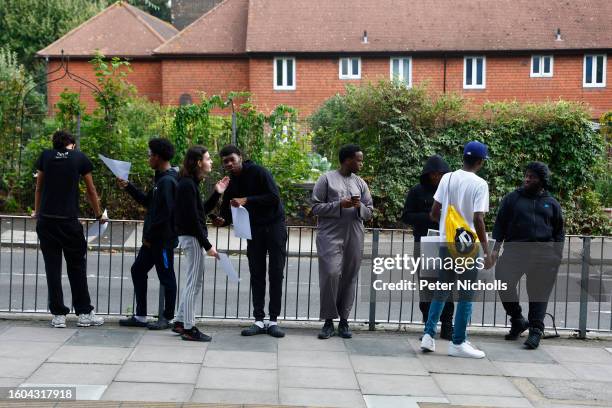 Students talk outside after receiving their A-Level results at City of London Academy on August 17, 2023 in London, England. Due to a change in the...