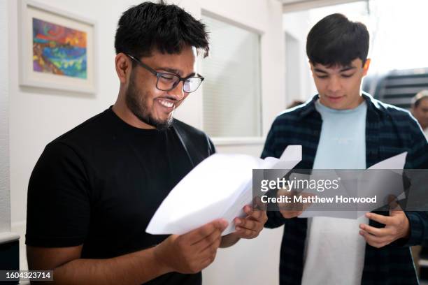 Umair Abdullah and John Bose receive their A Level results at Ffynone House School on August 17, 2023 in Swansea, Wales. Due to a change in the way...