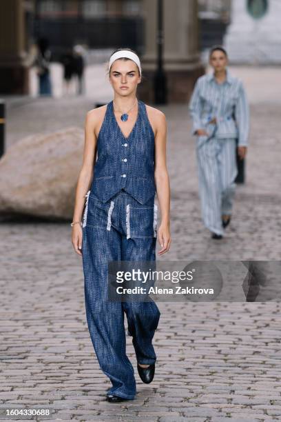 Model walks the runway at the Baum und Pferdgarten show during the Copenhagen Fashion Week Spring/Summer 2024 on August 09, 2023 in Copenhagen,...
