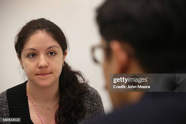 Immigration attorney Andres Lemons advises Evie Gomez on her U.S. Citizenship application on January 31, 2013 in New York City. The Canadian...