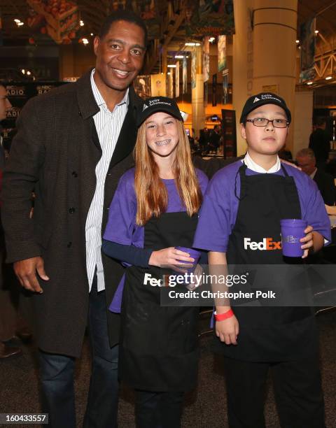 Hall of Fame player and football analyst Marcus Allen attends the FedEx lemonade stand with Junior Achievement students in the Super Bowl XLVII Media...