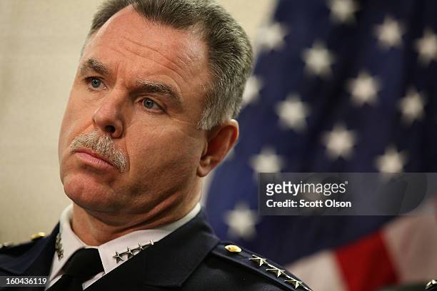 Chicago Police Superintendant Garry McCarthy listens as Mayor Rahm Emanuel discusses a plan to reassign 200 police officers from administrative...