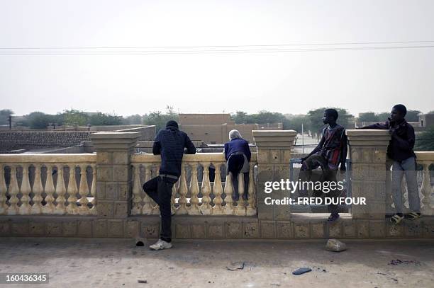 Children play on the house's rooftop of Sanda Ould Boumama, the spokesman of Mali's Islamist Ansar Dine rebel group, on January 31, 2013 in Timbuktu....