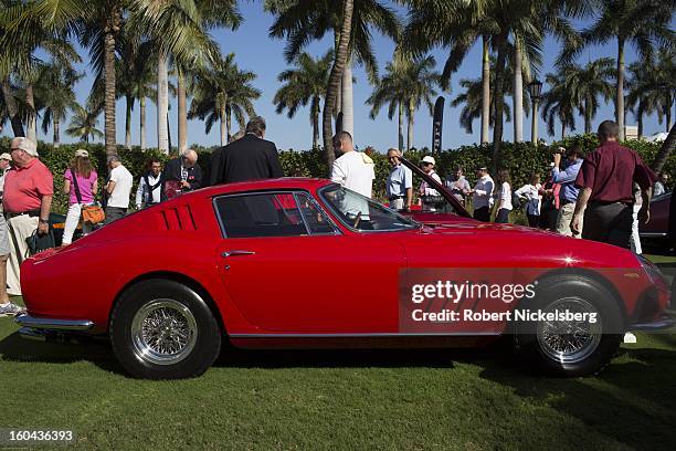 Judges discuss the quality of an antique Ferrari 275 GTB/4 automobile at the annual Cavallino Auto Competition, January 26, 2013 held at The Breakers...