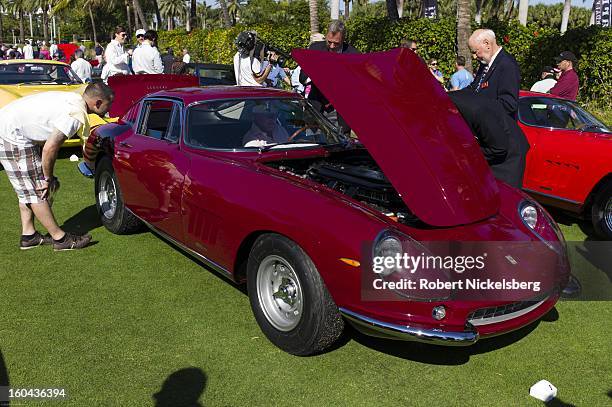 Judges discuss the quality of an antique Ferrari 275 GTB/4 automobile at the annual Cavallino Auto Competition, January 26, 2013 held at The Breakers...