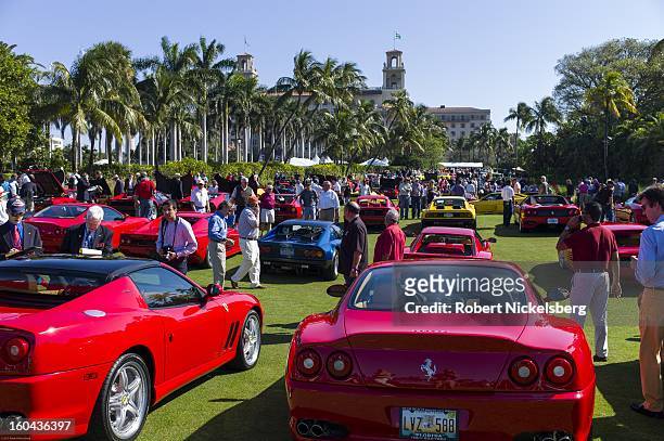Spectators view a field of new and antique Ferrari automobiles at the annual Cavallino Auto Competition, January 26, 2013 held at The Breakers Hotel...