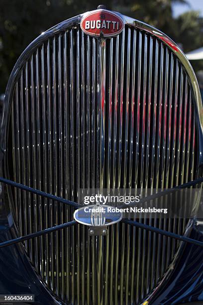 Spectators view an antique 1931 Bugatti racing car at the annual Cavallino Auto Competition, January 26, 2013 held at The Breakers Hotel in Palm...