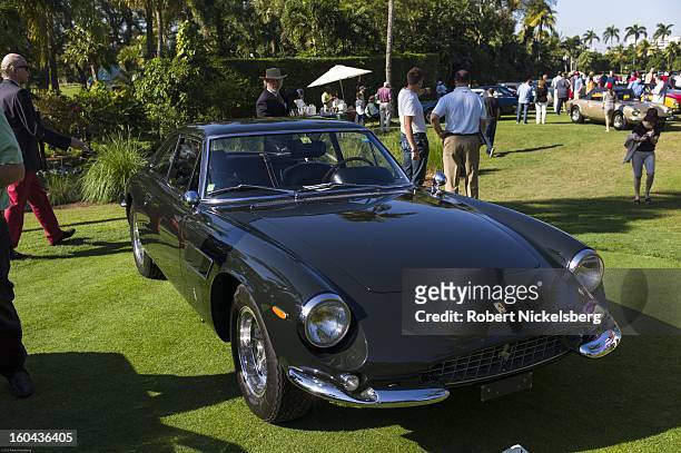 Judges discuss the quality of a 1966 500 Superfast antique Ferrari automobile at the annual Cavallino Auto Competition, January 26, 2013 held at The...
