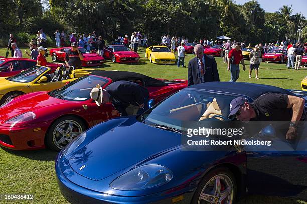 Judges discuss the quality of a 2003 Ferrari Enzo automobile at the annual Cavallino Auto Competition, January 26, 2013 held at The Breakers Hotel in...