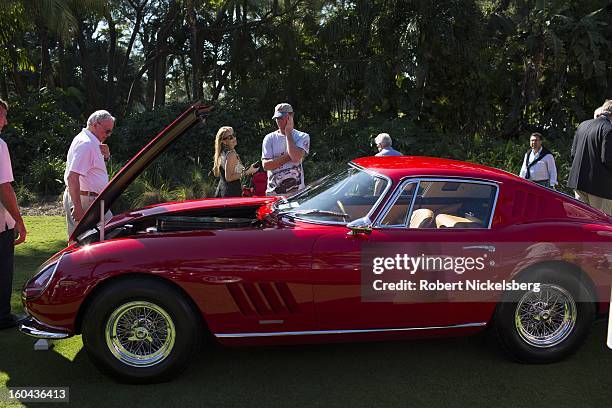 Spectators view an antique Ferrari 275 GTB/4 automobile at the annual Cavallino Auto Competition, January 26, 2013 held at The Breakers Hotel in Palm...