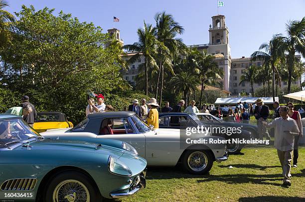 Spectators tour an antique Ferrari automobile competition at the annual Cavallino Auto Competition, January 26, 2013 held at The Breakers Hotel in...