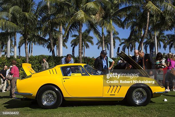 Judges discuss the quality of an antique Ferrari 275 GTB/4 automobile at the annual Cavallino Auto Competition, January 26, 2013 held at The Breakers...