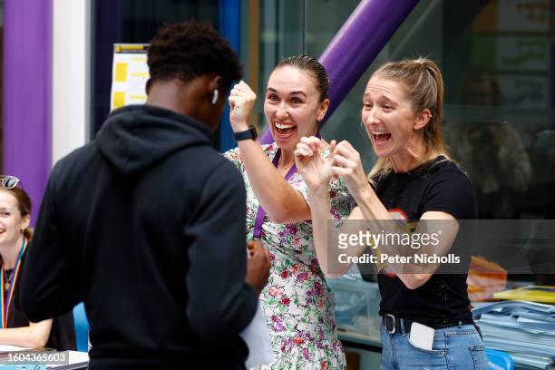 Members of teaching staff react to a student's results after receiving his A-Level results at City of London Academy on August 17, 2023 in London,...