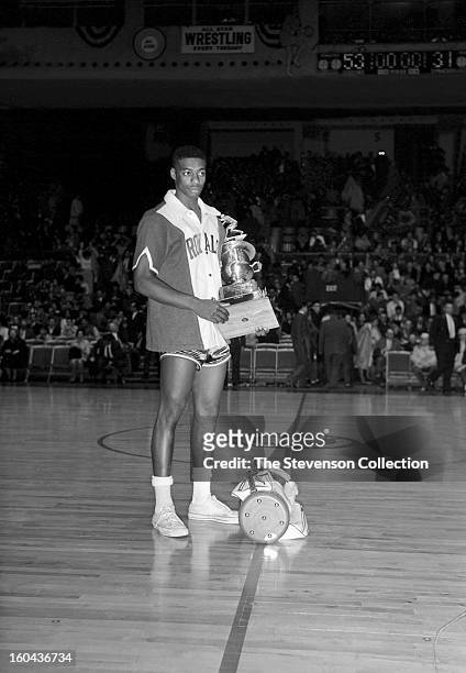 Oscar Robertson of the Cincinnati Royals is awarded the 1961 NBA All-Star MVP Trophy after the 1961 NBA All-Star Game circa 1961 in Syracuse, New...