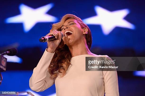 Singer Beyonce performs the National Anthem at the Pepsi Super Bowl XLVII Halftime Show Press Conference at the Ernest N. Morial Convention Center on...