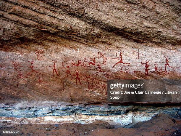 neolithic hunting scene, libyan sahara - cave painting stock pictures, royalty-free photos & images