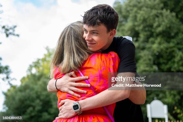 Noah Dunstan hugs his mum after receiving his A Level results at Ffynone House School on August 17, 2023 in Swansea, Wales. Due to a change in the...