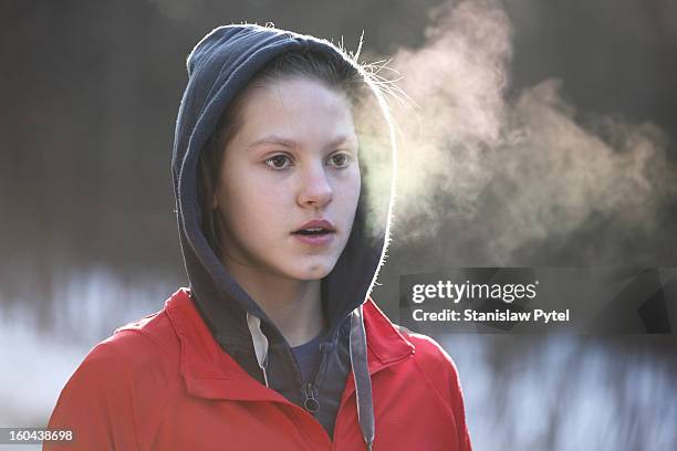 portrait of girl breathing during morning jogging - breath vapor stock pictures, royalty-free photos & images