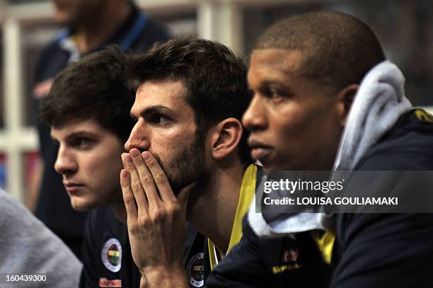 Fenerbahce Ulker players react from the substitutes' bench on January 31, 2013 during an Euroleague group F, top 16 basketball game at the Peace and...