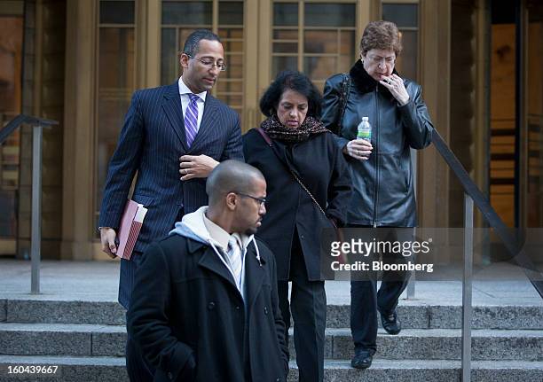Roomy Khan, a former Intel Corp. Executive, center, exits federal court with her lawyer Stanislao German, left, following a sentencing hearing in New...