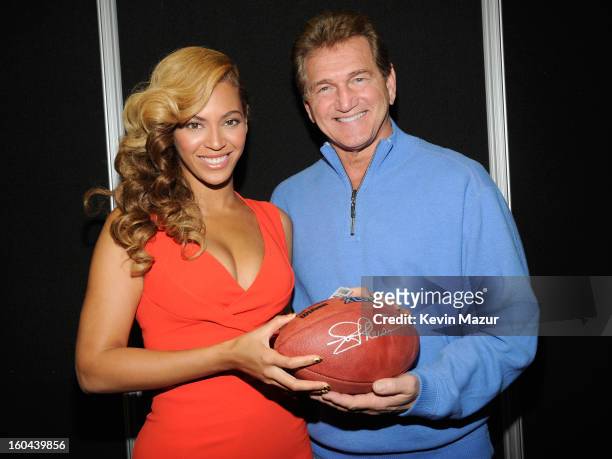 Beyonce and former NFL player Joe Theismann pose backstage at the Pepsi Super Bowl XLVII Halftime Show Press Conference at the Ernest N. Morial...