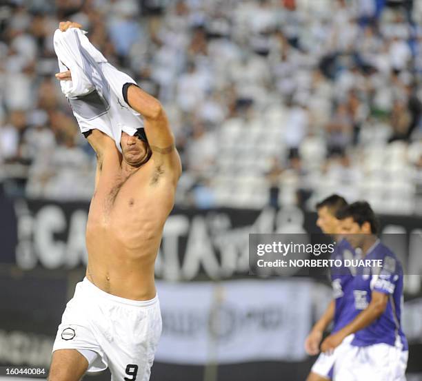 Paraguay´s Olimpia player Juan Carlos Ferreyra celebrates after scoring against Uruguay´s Defensor during their 2013 Copa Libertadores football match...