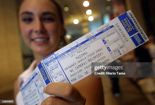 Madonna fan holds a cherished ticket prior to Madonna''s concert July 25, 2001 at Madison Square Garden in New York City.