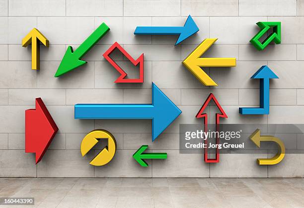arrows pointing in different directions - directional signs stock pictures, royalty-free photos & images