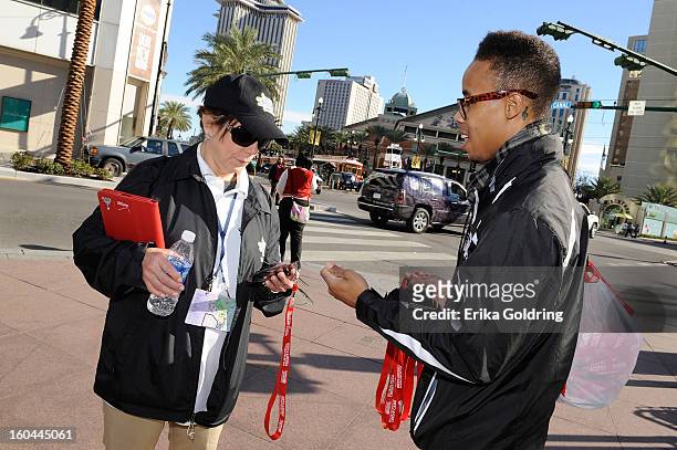 The NFL Extra Points Credit Card Street Team distributes masks for a chance to win tickets to Super Bowl XLVII on January 31, 2013 in New Orleans,...
