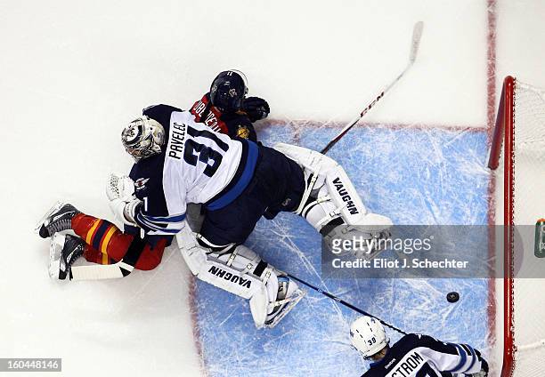 Jonathan Huberdeau of the Florida Panthers shoots and scores against Goaltender Ondrej Pavelec the Winnipeg Jets at the BB&T Center on January 31,...