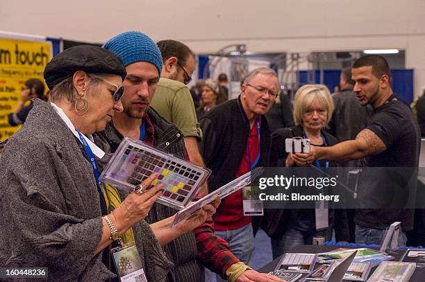 Attendees look keyboard accessories made for Apple Inc. Products at the Macworld/iWorld conference at the Moscone Center West in San Francisco,...