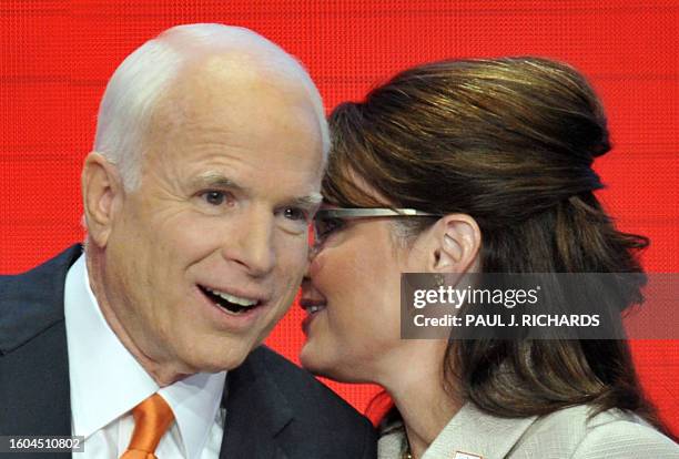 John McCain, the presumptive US Republican presidential nominee, stands on stage with vice presidential nominee Sarah Palin after her acceptance...