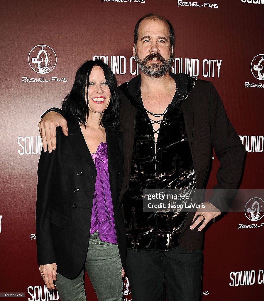 Krist Novoselic and wife Darbury Stenderu attend the premiere of