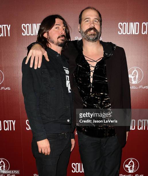 Dave Grohl and Krist Novoselic attend the premiere of "Sound City" at ArcLight Cinemas Cinerama Dome on January 31, 2013 in Hollywood, California.