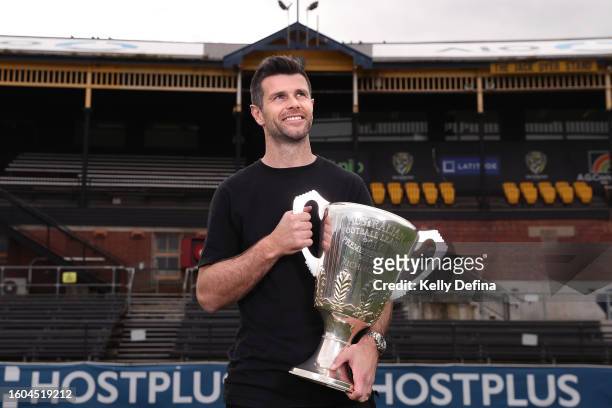 Trent Cotchin poses for a portrait with the 2017 premiership cup after announcing his retirement from AFL during a press conference at Punt Road Oval...