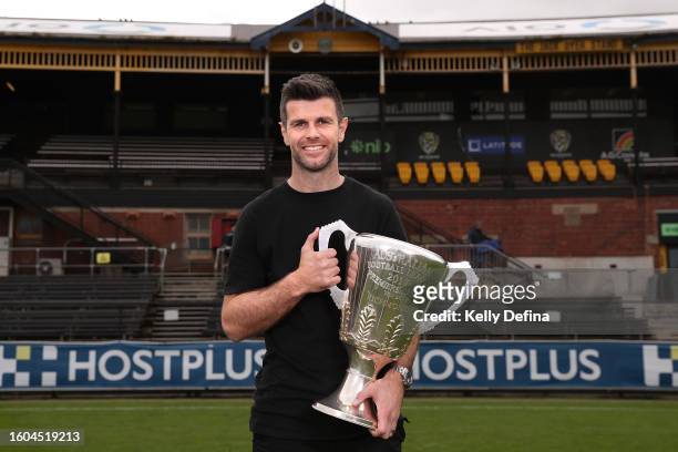 Trent Cotchin poses for a portrait with the 2017 premiership cup after announcing his retirement from AFL during a press conference at Punt Road Oval...