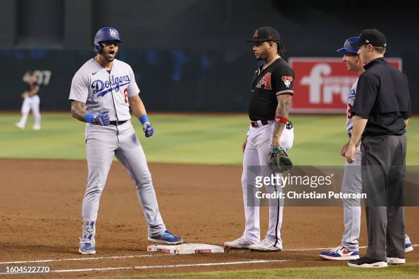 David Peralta of the Los Angeles Dodgers celebrates after hitting a two-RBI single against the Arizona Diamondbacks during the eighth inning of the...