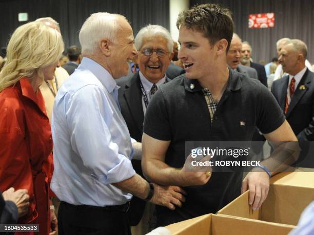 Republican presidential candidate John McCain jokes with his son Jimmy at the GOP Delegates Hurricane Relief Activity at the Minneapolis Convention...