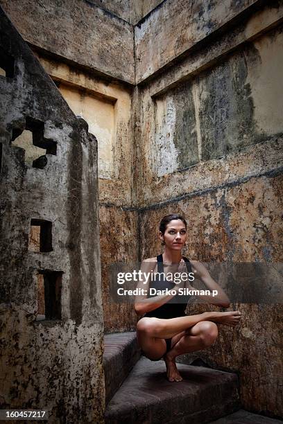 padangushthasana - one-legged squat - rishikesh yoga stock pictures, royalty-free photos & images