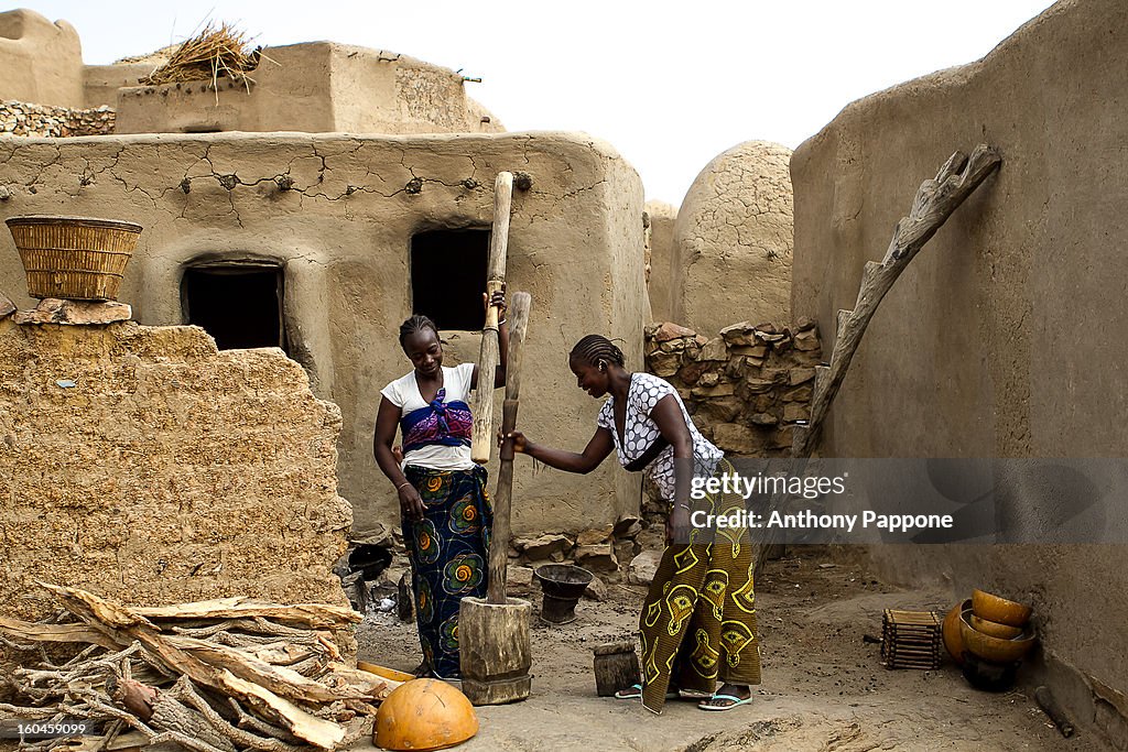 Women pounding millet