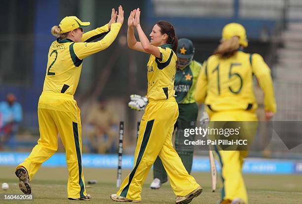Megan Schutt of Australia celebrates the wicket of Pakistan captain Sana Mir during the second match of ICC Womens World Cup between Australia and...