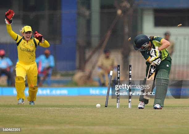 Pakistan captain Sana Mir is bowled out by Megan Schutt of Australia during the second match of ICC Womens World Cup between Australia and Pakistan,...