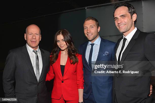 Actors Bruce Willis, Julia Snigir, Jai Courtney and Rasha Bukvic attend the dedication and unveiling of a new soundstage mural celebrating 25 years...