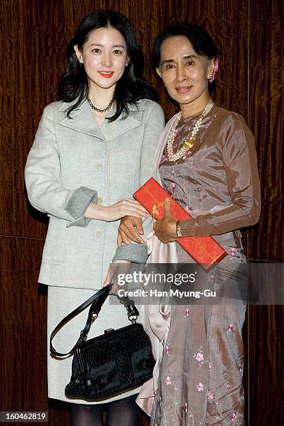 South Korean actress Lee Young-Ae and Myanmar's opposition leader, Aung San Suu Kyi pose for media after their dinner at the Westin Chosun Hotel on...